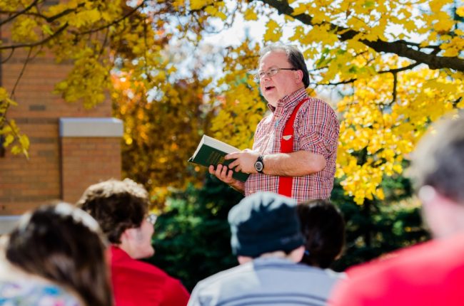 Dr Holmes teaching class outside Dr Holmes teaching class outside
